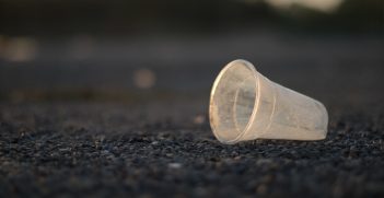 A piece of plastic waste discarded on the ground. 
Source: Flickr, Ivan Radic https://bit.ly/3teufqE 