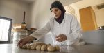 Women’s Cooperative Leader Daed Ismaiel makes a rare, traditional bread called Mallet El Smid to be sold at the MENNA shop in Beirut. Source: UN Women/Joe Saade https://bit.ly/3M5NJ8Q