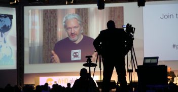 Assange speaks remotely at WHD Global 2014. 
Source: World Cloud News, Flickr, https://bit.ly/3IyNdiO. 