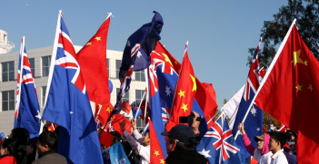 Australian and Chinese Flags.
Source: Michael Lieu / Flikr. 
https://bit.ly/3yLpybZ