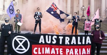 Activists from Extinction Rebellion burnt an Australian flag on the steps of the Victorian Parliament, Melbourne, in protest against the federal government for its inaction on the climate emergency.
The action coincided with the first day of the COP26 climate conference in Glasgow.
Source: Matt Hrkac, Flickr, https://bit.ly/3CeuWXh. 