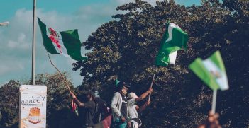 Group of People Waving the Nigerian Flag. Source: STRAWHAT Soile/https://bit.ly/3jjnWkz
