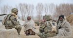 British Soldier Talking to Afghan Civilians with an Interpreter During a Patrol. Source: Sgt Wes Calder RLC / https://t.ly/OWDrc

