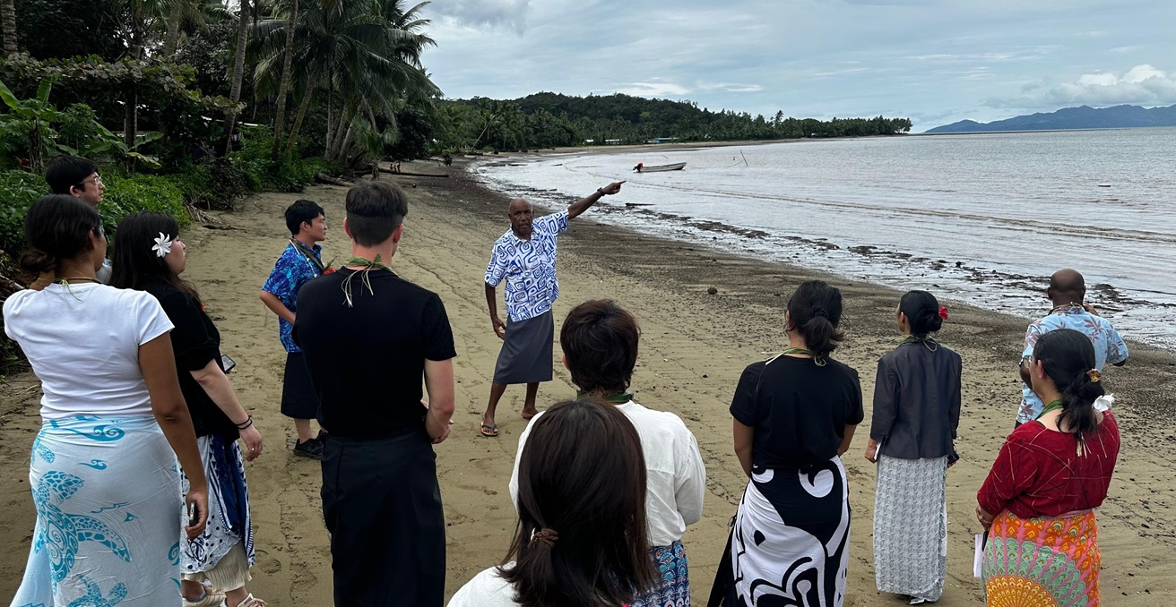 68-year-old Setariki Alusio, nephew of the Chief of the Fijian village of Galoa, explains how the sea has come in 30 metres in the last 40 years. Photo: Bryce Wakefield